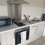 Modern kitchen with appliances and utensils